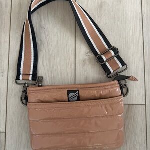 Stylish Tan Crossbody Bag with Striped Strap